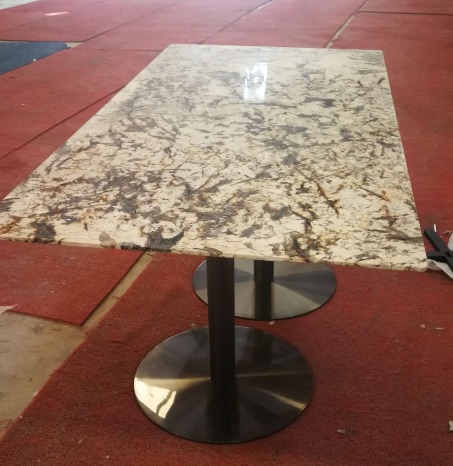 Patagonia granite hotel table tops black stainless steel legs Granite